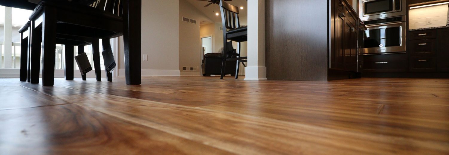 Brown hardwood flooring in dining room