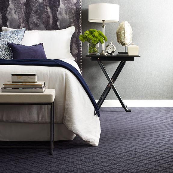 Dark blue carpet in a bedroom